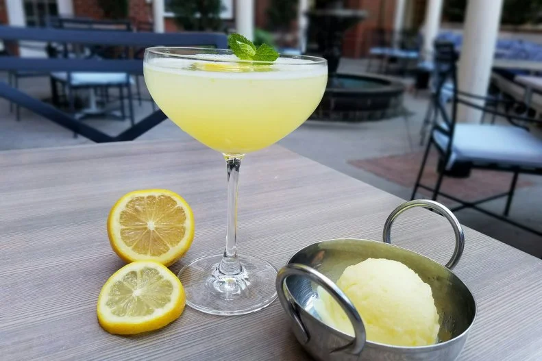 This rustic Italian restaurant on the campus of Auburn University riffs on the classic Venetian cocktail with this slushy libation that can be slurped alfresco, as a palate cleanser or as an after-dinner digestivo. Lemon sorbet and prosecco are whisked until smooth, topped with chilled grappa and limoncello, and garnished with mint and a candied lemon wheel.