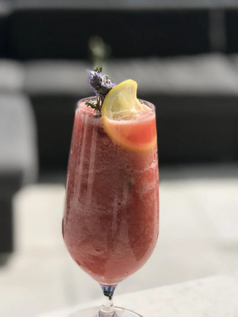 During his travels to Spain and Italy, lead bartender Benny Hernandez learned to appreciate both Aperol and Tinto de Verano (red wine mixed with Coke or Sprite). Here, he lends a Miami-friendly Caribbean twist by adding blanco tequila and guava purÃ©e to lemon juice, merlot and Aperol, which are blended and served in a hurricane glass garnished with a lemon wheel and thyme sprig.