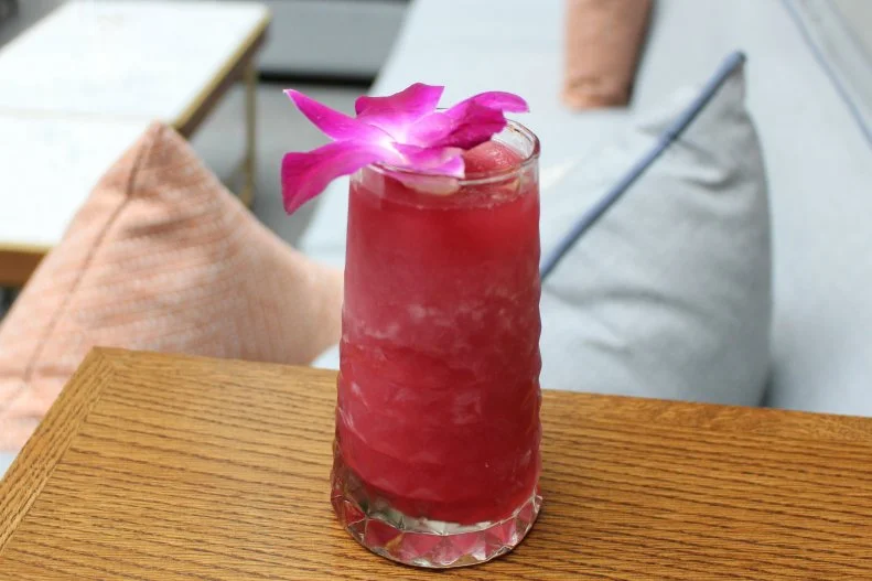 An adult nod to its silver pouch-packaged namesake, this cocktail summons flavors from pisco, green tea-infused vermouth, vodka, elderflower liqueur, strawberry-pink peppercorn syrup, passion fruit green tea and lemon juice. It’s served in a gem highball glass with an orchid blossom, so there’s no need to struggle poking a hole with a wimpy plastic straw.
http://www.boleochicago.com/