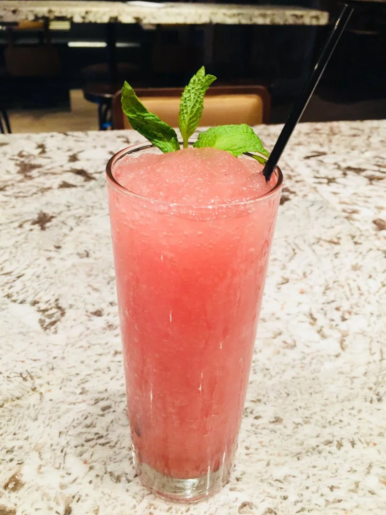 This blended mashup between a champagne cocktail and a mojito combines pomegranate juice, white rum, simple syrup and prosecco, served in a highball glass garnished with a mint sprig. Light and refreshing, it works just as well for day drinking as it does for warm summer evening imbibing, with an added dose of antioxidants from the juice procured from those red arils.