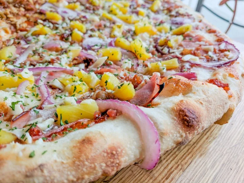 Set right on Boulder's University Hill, this creative pizzeria is a favorite late-night haunt for local students. The pizzas themselves seem as though they've sprung from a late-night hallucination. Thin, New York-style crusts come adorned with such unusual options as macaroni noodles, tater tots, alfredo and the shop's signature chipotle ranch Bossy Sauce. The spot offers a dizzying selection of about 50 different specialty pies, which are all available by the slice. One standout is the MoFo Hawaiian, a barbecue sauce base coated with Grande mozzarella cheese, red onion, ham, pineapple, bacon, asiago and parsley.