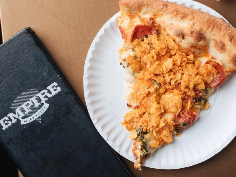 You know you’re doing something right when locals tattoo themselves with your logo. This OKC slice shop has such an intense following that more than 65 fans have gotten inked with Empire Slice House “E” tattoos. Around six different slice options are available daily at this ‘90s hip-hop themed restaurant, which also offers whole pies. The slice selection rotates regularly. One day, it might be the Ghost Killa with searing ghost chili marinara, pepperoni and poblano sprinkled with barbecue chips. Another day, it could be the Spuds MacKenzie, a retro blend of Cheez Whiz (yes, Cheez Whiz), roasted potato, bacon, jalapenos and cheddar topped with scallions and sour cream.