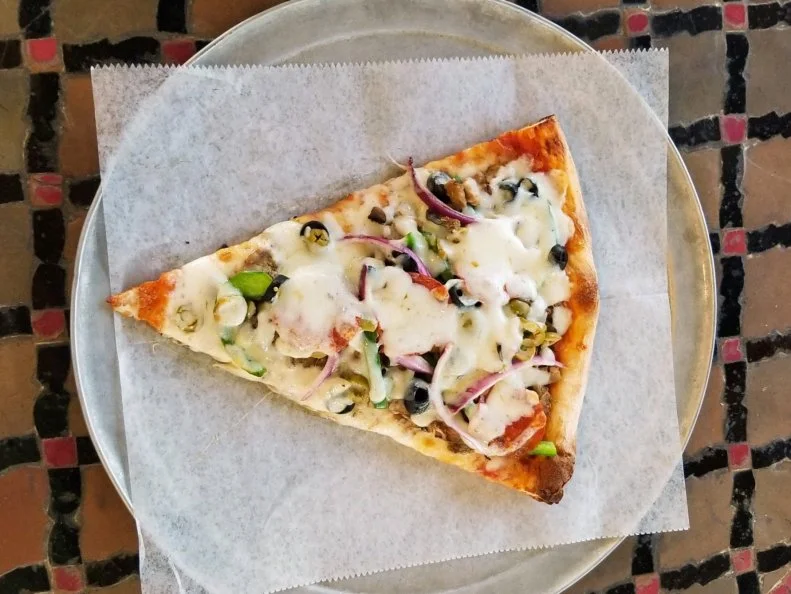 The $2.75 slices served at Fellini's have reached Atlanta icon status. Not only are these massive slices affordable, but they're also available until the wee hours of the morning. It has proven to be a winning formula for the cherished New York-style pizzeria, which has grown from one shop in 1982 to a total of six locales throughout A-Town today. Order the local favorite, Fellini's Special. Available by the pie or the slice, the namesake pizza comes loaded with pepperoni, mushrooms, Italian sausage, onions, meatballs, green peppers, black olives, green olives and extra cheese.