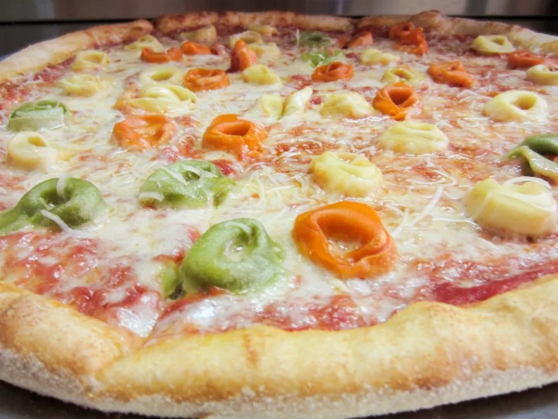 Two words: tortellini pizza. This Baltimore spot takes the concept of mac ‘n’ cheese pie to the next level by topping cheese pizza with tri-colored tortellini. That creative combo has proven to be the most-popular pick at this cheery counter-serve space. A close second is the Meat Lovers option loaded with pepperoni, sausage, ham, bacon and ground beef. Mario’s has mastered the art of a crisp browned crust slathered in a bright sauce, which means you’ll have a stellar slice even if you strip away all the rich toppings. Both the pepperoni and cheese options may well be this spot’s sleeper hits.