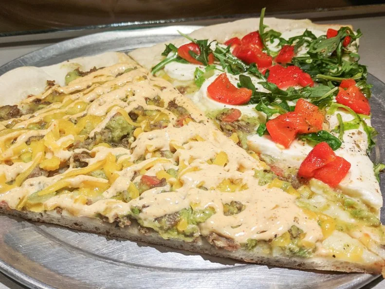 When owner Luis Hernandez founded this Iowa City shop in 2006, his goal was to offer customers pizza combos they wouldn't be able to find anywhere else. He has realized his plan with a unique selection that includes such pairings as steak and guacamole with Southwest sauce and cheddar cheese. The pizzeria offers more than 100 different types of slices to customers at any given time. While there are plenty of picks, the most-popular selections tend to be chicken-centric: Barbecue Chicken Bacon Ranch, Buffalo Chicken and Thai Chicken. Oh, and mac lovers, don't miss out on the Macaroni and Cheese.