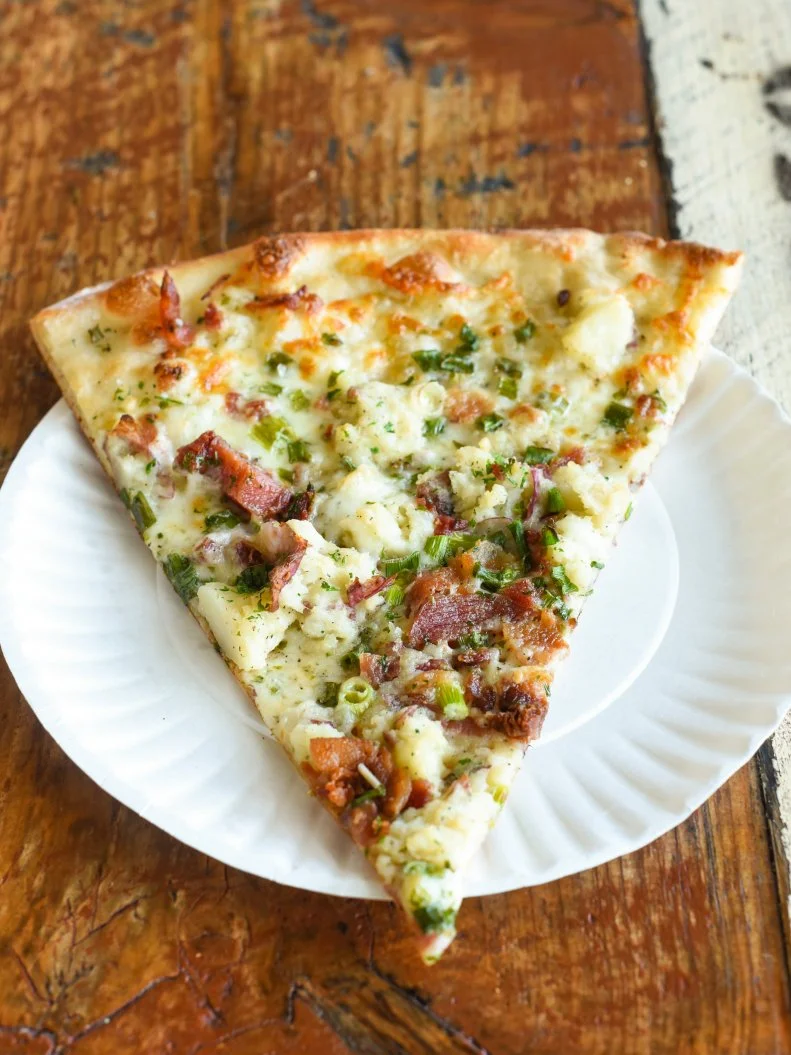 Hailed for its perfectly thin and crisp crusts cooked in a 650-degree oven, Otto consistently ranks as one of the best pizza places in Maine. Every slice at Otto comes stacked with high-quality ingredients that are locally sourced whenever possible. Basic pepperoni is the most-popular pick, followed by The Masher. Inspired by the tastes of a traditional dinner side, this slice features a mix of mashed potato, bacon and scallions. The combination of superb crusts and stellar toppings has earned Otto much success. Since opening on Portland's hip Congress Street in 2009, owners Mike Keon and Anthony Allen have expanded their operation to an additional five locations in the Pine Tree State, as well as another half dozen spots in neighboring Massachusetts.