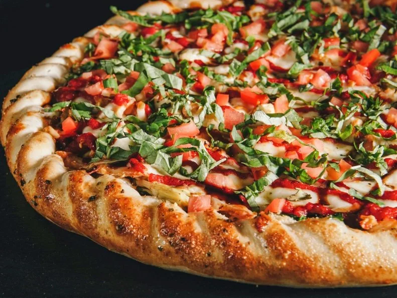 A true local’s secret, this subterranean restaurant is hidden beneath the University Pharmacy, just steps away from the University of Utah. You pretty much need to know exactly where to look if you hope to find the gateway to some great slices — The Pie only has one sign hidden behind a wall on South 1320 East. But the hunt is worth it. Since 1980, the spot has been turning out pizzas made from hand-tossed dough dressed up with innovative flavor combinations. To wit, the Wise Guy is layered with cream cheese, fresh spinach, artichokes, chicken breast, mozzarella and tangy marina, then baked and topped with even more tomatoes, fresh-cut basil and a drizzle of sweet Balsamic reduction. If you’re lucky, you may even be able to score it as a slice of the day (this special option switches up daily).