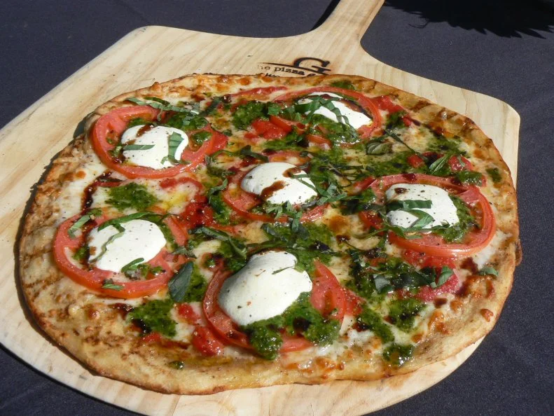 Following the ethos of the Providence grilled pizza tradition, this modest counter-serve restaurant cooks its pies over oak and maple hardwood at 1800 degrees. Doing so gives its crisp crusts that signature char and infuses its gourmet toppings with the subtle scent of a smoky campfire. Pies feature classic but rare flavor combinations in picks like the Fig Prosciutto with paper-thin shreds of Italian ham, fig puree, crumbled gorgonzola and arugula with a balsamic drizzle. It’s sweet and savory with some nice funk; definitely worth a try. But, here, even the simple margherita is truly sublime.