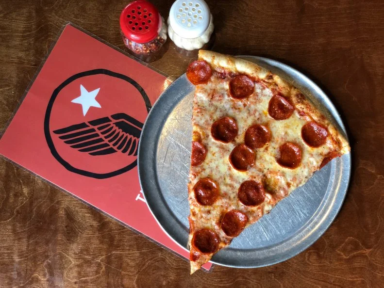 This pizzeria and craft brew joint is about as cool as it gets. Opened in 2015, it’s located in a former VFW Post in one of Louisville’s hippest ‘hoods. Renovations have left the space a bit sleeker, but Americana accents throughout pay homage to the building’s past life as a hangout for veterans. The spot is known for its chill atmosphere and elevated bar fare. The menu features a rotating selection of American craft beer, subs, salads and specialty pies. According to owner Nash Neely, the New York-style slices are the “best thing on the menu.” Options include cheese and pepperoni, along with a slice of the day that can range from a typical topping trio of sausage, mushroom and roasted red pepper to unexpected riffs like bacon, giardiniera and pineapple atop a beer cheese base.