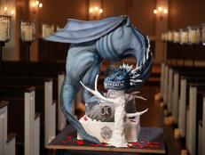 The London Baker's completed Game of Thrones themed wedding cake features a dragon, vibrant red leaves, the "Iron Throne," and other detailed accessories to bring the entire theme together, as seen on Food Network's Dallas Cakes, Season 1