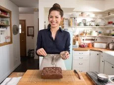 Host Molly Yeh Prepares her Olive Oil Blondies with Chocolate Frosting, as seen on Girl Meets Farm, Season 1.