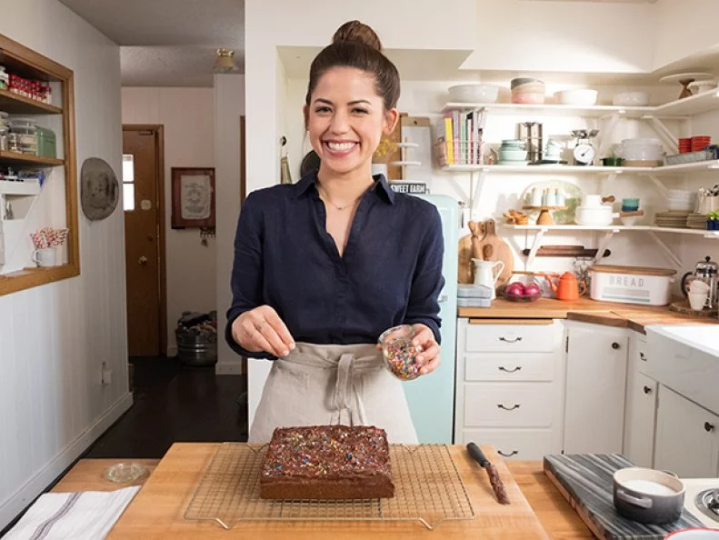 Host Molly Yeh Prepares her Olive Oil Blondies with Chocolate Frosting, as seen on Girl Meets Farm, Season 1.