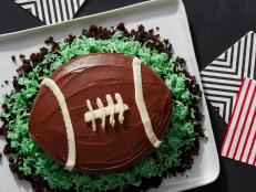 No special cake pan required: This adorable game day football is made from two cleverly cut cake rounds. Nothing goes to waste-- the trimmings become edible dirt, topped with coconut grass. Touchdown.