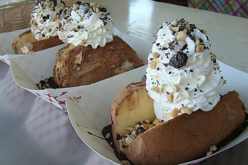 With Idaho being one of the top-producing dairy states, ice cream is a no-brainer at summer fairs. But one booth at the Western Idaho Fair in Boise goes all out with a frozen treat inspired by the official state vegetable. The Idaho Ice Cream Potato is a sundae cleverly disguised as a baked potato: vanilla ice cream stands in for the potato, cocoa powder dusted on the outside mimics potato skin and a mound of whipped cream calls to mind sour cream. The ice cream potato comes perched on a slick of chocolate syrup and festooned with nuts and crushed Oreos, not to mention more chocolate sauce. Though it’s a longstanding fair tradition, the dish took home top honors at The Fair Food Showdown in 2017 for Best Sugar Rush and Best Crowd Pleaser. In addition to its annual appearance at the fair, this ice cream potato is available year-round at Westside Drive In.