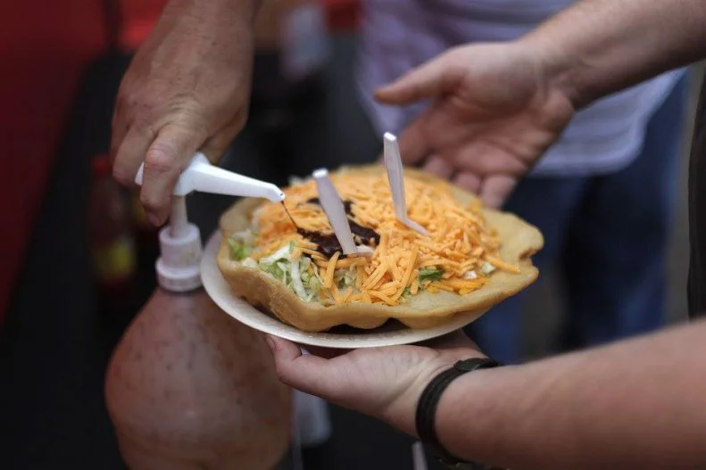 Oklahoma is home to The National Indian Taco Championships in Pawhuska, so it’s no surprise that Indian Tacos are one of the Oklahoma State Fair’s signature dishes — with an average of 45,000 to 50,000 sold annually. Indian tacos are made with fry bread, a traditional Native American staple used as the base of many meals. Typically, the fried round of dough is layered with standard taco toppings like seasoned ground beef, beans, lettuce, tomatoes and cheese, though you can also find versions made with brisket, steak and grilled or shredded chicken, as well as less common add-ons like sliced black olives, jalapenos and serrano chiles. Look for Indian tacos at vendors like Manny's Elephant Ear, Tad’s Indian Tacos and Dan’s Indian Tacos, where you can also order fry bread with sweet toppings like honey and powdered sugar.