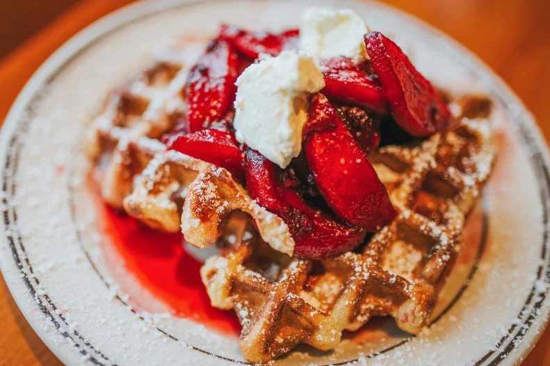 Old newspapers line the walls of this huge-but-homey brunch spot, which has a well-stocked pastry case and one of the best morning meals in town. Crisp on the outside, fluffy on the inside and slightly tart, the hefty Belgian waffle ($9) comes topped with a seasonal-fruit compote — berries in the summer, apples or pears in the fall — fresh whipped cream and a side of maple syrup. You may have to stand in a long line to order it, but that’s nothing compared to Portland’s many hour-plus waits for brunch, especially with a cup of self-serve coffee in hand.