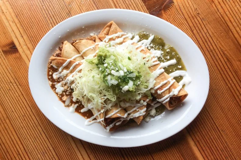 Most of the tacos at this Tex-Mex cantina on a buzzy strip of Killingsworth Avenue are on the smallish side. But the rolled ones are an exception. Stuffed with fluffy potatoes and topped with shredded lettuce, crema and a scoop of guac, they’re served in orders of three ($5) for more than enough food to make a meal (though you’d be remiss not to at least nibble on a few tortilla chips dipped in queso, too).
