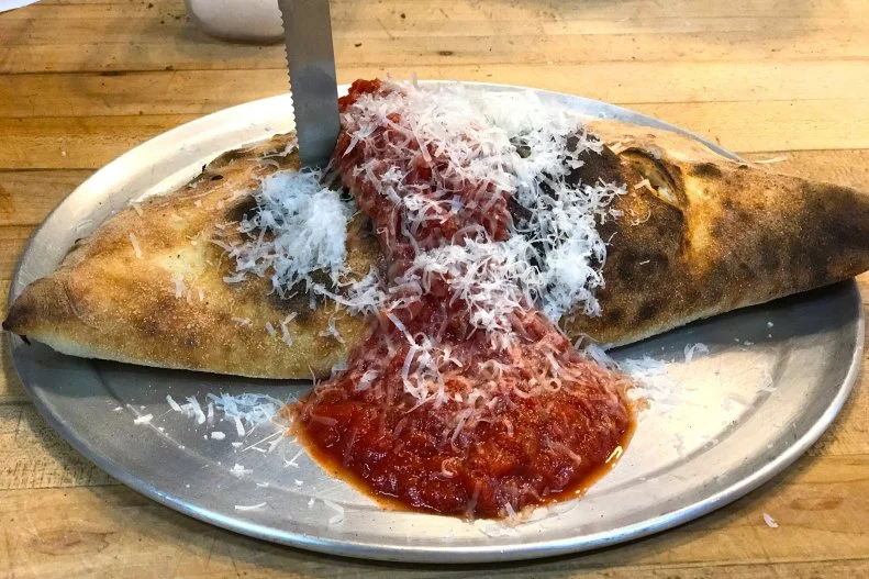 Yes, this inside-out pizza pocket costs $14, but it serves two. And it comes from a woman-owned and –operated, proudly feminist pizza shop that frequently hosts nonprofit fundraisers and has a chalkboard out front that reads “Pizza Rolls, not Gender Rolls.” Choose from two meat options, the vegan Olivia Benson (named for Mariska Hargitay’s character on Law & Order) or a build-your-own calzone with any of the pizza toppings on the menu, including housemade pickled peppers, sausage and bacon. They’ll bring you Andes mints with your check, but nonetheless, order the pizzeria’s one dessert: foil-wrapped chocolate cake with cream filling, a riff on the Ding Dong, from Treat Vancouver bakery.