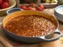 Katie Lee makes Peach Bourbon Bacon Baked Beans, as seen on The Kitchen, Season 17.