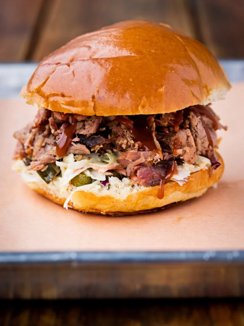 There are several well-worn food laments for Washingtonians —no spots for good bagels, New York pizza, etc. But when it comes to barbecue, one taste of Sloppy Mama’s chopped pork sandwich will banish all Texas yearnings. It’s smoky, savory, sweet and satisfying. Order it on a bun at the Union Market stall for $10, and maybe add a side of baked beans for $3 more, or go for a “meat and two” platter for $15.