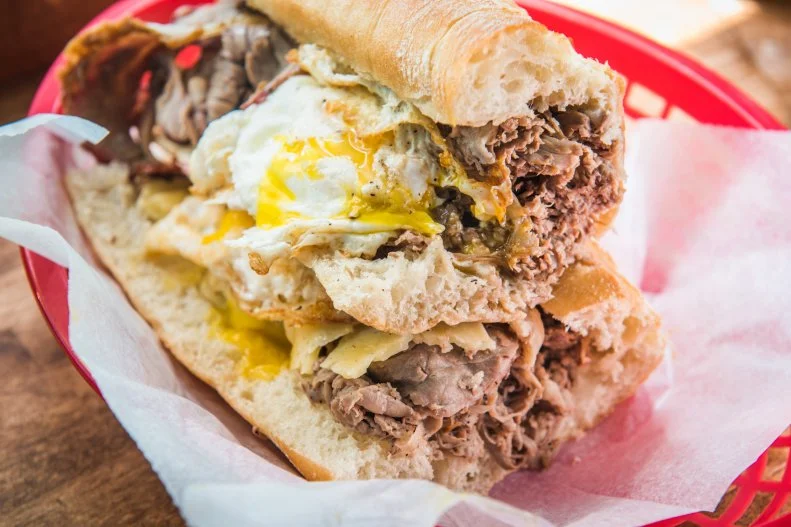 This subterranean sandwich shop — run by a chef and his parents — easily won the heart of locals with its mom-and-pop feel and gargantuan sandwiches. Among the roster of satisfying options is the signature beef brisket, a torpedo-sized umami bomb that would satisfy the hunger of a sumo wrestler stranded on a desert island. The slow-braised brisket slathered with apple-horseradish cream, aged gouda and veal jus sells for $10 a half or $18 for a whole sub, and you shouldn’t need much convincing to spring for the fried egg on top for $1 more.