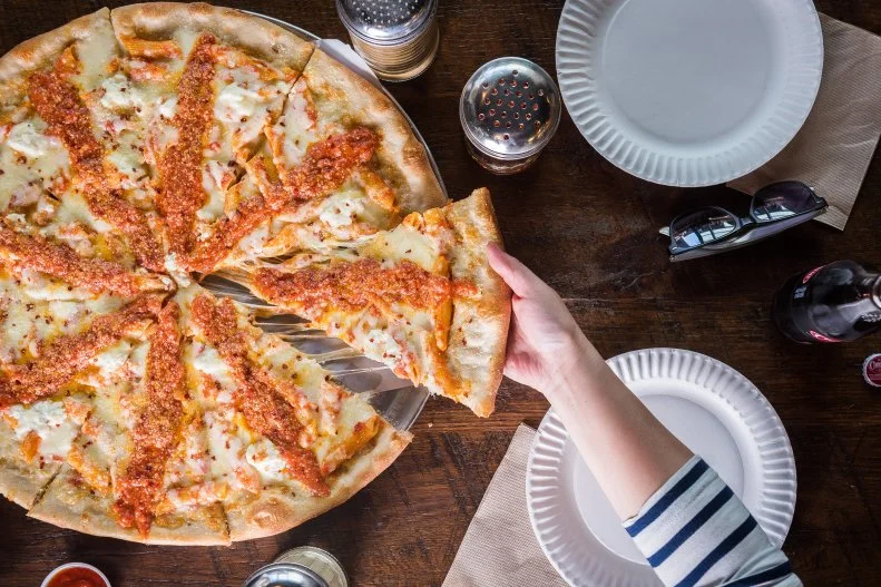 Washington may be a quick train ride from New York, but it doesn’t mean the New York pizza abounds. For the next best thing, dive into Wise Guy. Sure, you could go traditional with the supreme or margherita, but why not indulge with some carb-on-carb love and order a slice loaded up with creamy, tomato-y pasta? Slices from the 20-inch pies cost a very reasonable $2.99-$3.99, making this filling lunch very pennywise.