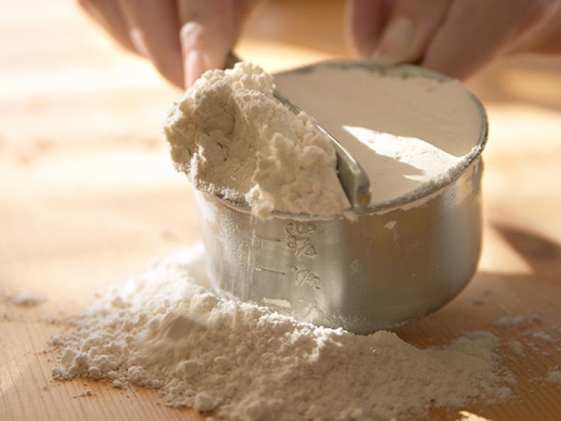 Baking - measuring flour.