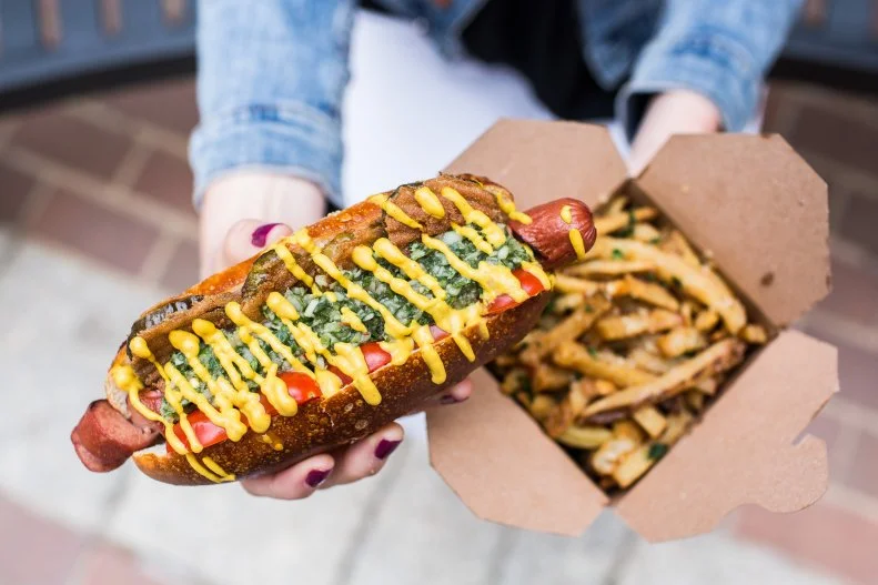 Can you teach a dog new tricks? The owners of food truck Swizzler seemed to think so when they took the beloved hot dog and traded in the mystery-meat version for a grass-fed beef variety. They also took liberties with the toppings and partnered with a local bakery for the buns. The truck has such a major following that a brick-and-mortar location will open in the fall. A favorite menu item is the Abe Froman, named after the fictional “sausage king of Chicago” — thanks, Ferris Bueller. This dog is topped with a bright cucumber-and-herb relish, fried bread-and-butter pickles, grape tomatoes, chopped white onions and Sir Kensington’s mustard, all stuffed into a pretzel bun.