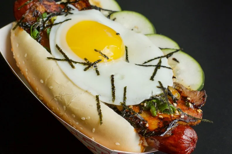 Korean and American food favorites unite at this Las Vegas hot dog joint that takes its name from two popular foods — “Buldogis” is a mash-up of “bulgogi” and “hot dog.” The menu follows suit, topping the all-American hot dog with Korean ingredients, as with the Gang Nam Dog (with optional fried egg), a quarter-pound beef dog with roast pork belly, cucumber, nori flakes, sesame seeds and Korean chile sauce.