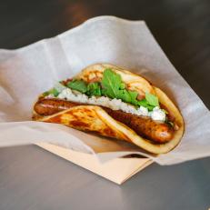 What started as a food truck in the Phoenix area morphed into a successful three-truck, two-shop business that’s all about the love of dogs — both puppies and hot dogs. Each of the hot dogs is named after a customer’s pooch and wrapped in naan instead of the typical bun. Choices include gourmet dogs like the Sunny, a chicken hot dog topped with prosciutto, grilled peaches (or pears in the off season), locally made goat cheese, arugula and a drizzle of honey. For a sweet treat, Short Leash offers Rollover Doughnuts, which are brioche doughnuts made from scratch.