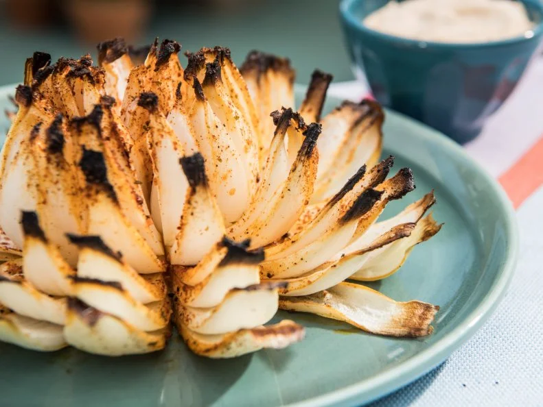 Katie Lee makes a Grilled Firework Onion, as seen on The Kitchen, Season 17.
