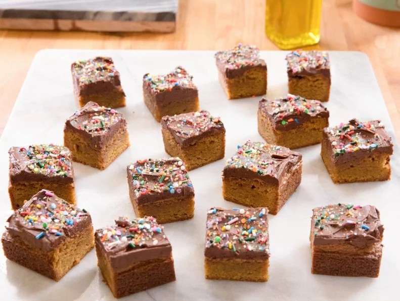 Molly Yeh's Olive Oil Blondies with Chocolate Frosting, as seen on Girl Meets Farm, Season 1.
