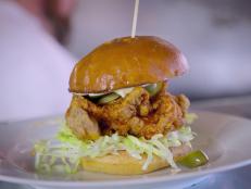 <p>Good eats, indeed. This Triple D destination offers up American fare that includes a must-try Nashville Hot Fried Chicken Sandwich and a Blueberry Bacon Blue Cheeseburger that's an absolute winner. Bonus: While waiting for your food, enjoy a drink from the Lucky 13 bar, located adjacent to Scolari's.</p>