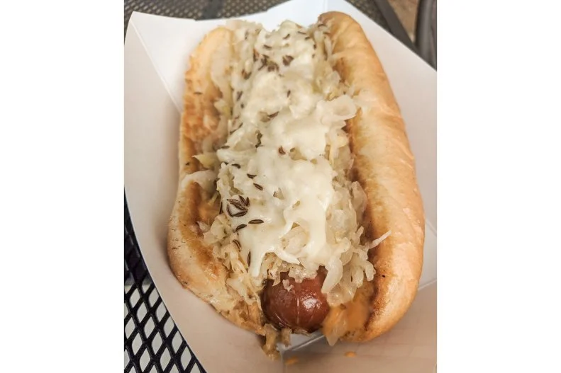 The specifics are cloudy but the most-credible story about the birthplace of the Reuben claims that the sandwich of corned beef, melted Emmental cheese and sauerkraut with Russian dressing on grilled marbled rye was created at Omahaâ  s Blackstone Hotel. So, it make sense that Nebraskans love their Reubens in any form, including hot dogs. At Bellevueâ  s B&B Classic  Dogs, one of the most-popular franks is the Cornhusker-inspired Rueben [their spelling], a quarter-pound Nathanâ  s beef frank covered with thousand island dressing, kraut, melted swiss and, to mimic the original bread, caraway seeds all nestled within a toasted bun. Guests can opt to get the whole thing, bun included, wrapped in a tortilla and dunked in the fryer.