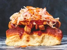 Ohio has strong dog-centric culinary traditions, including Cincinnati chili dogs. Back in the 1940s, the Polish Boy emerged on Clevelandâ  s fast food scene. Itâ  s a stack of coleslaw, barbecue sauce, hot sauce and a pile of fries loaded atop a smoky Polish-style kielbasa in a sturdy hot dog bun. It can be found all around the Rock and Roll Capital of the World, but one of the best examples is sold at Banter, a new-school sausage and poutine shop on the near west side.
