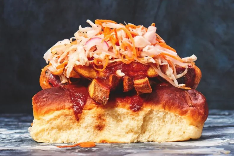 Ohio has strong dog-centric culinary traditions, including Cincinnati chili dogs. Back in the 1940s, the Polish Boy emerged on Clevelandâ  s fast food scene. Itâ  s a stack of coleslaw, barbecue sauce, hot sauce and a pile of fries loaded atop a smoky Polish-style kielbasa in a sturdy hot dog bun. It can be found all around the Rock and Roll Capital of the World, but one of the best examples is sold at Banter, a new-school sausage and poutine shop on the near west side.