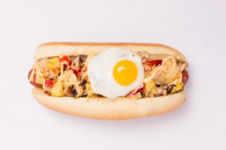 At some point in its flashy history, Las Vegas adopted a hot dog style all its own, the naked dog. Seriously. Exactly as it sounds, the dog is a simple char-grilled beef hot dog served simply in a plain bun. It’s either the most-perfect or most-inaccurate metaphor for Sin City, depending on how one looks at it. The modest dogs can still be found all over town, but one of the best places to munch into one is Cheffini’s Hot Dogs. There, guests can sample the classic naked dog in all its bare glory or follow the city’s ostentatious vibe with an array of diverse and showy toppings ranging from seaweed, avocado and pickled mango to dry chorizo, pork belly and fried quail egg.