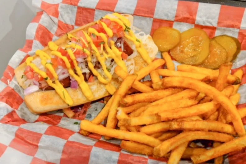 Bringing a taste of New Orleansâ   nouveau gourmet frankfurter trend to Hattiesburg, Mississippi, Dis and Dem offers a nationally inspired selection of wieners, including the beer-battered fried-cod Pacific Dog, a classic Chicago Dog and the grilled gator Swamp Dog. Each is inspired, but the simple Mississippi Dog is the way to go. Grilled Polish Kielbasa, made from garlic- and paprika-scented beef, is topped with choice of cooked or fresh sauerkraut, onions, tomatoes and mustard. Itâ  s straightforward, flavorful, crisp yet juicy, but if you really feel the need to jazz it up, opt for the Creole mustard on top.