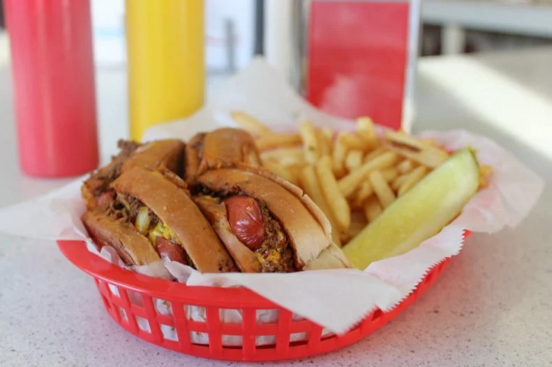 Vermonters love their chili dogs, but they canâ  t decide on a name. Depending on where you are in the Green Mountain State, your hot dog covered with chili, chopped raw onions and yellow mustard may be referred to as a Michigans, a Red Hot or a Coney Island. At third-generation-owned Handyâ  s Lunch in Burlington, the iconic chili dog is called a Texas Dog. The year-round treat includes snappy dogs coated with all the compulsory toppings stuffed inside a classic top-loaded New England-style bun thatâ  s griddled until buttery-crisp on the outside with that signature pillowy interior.
