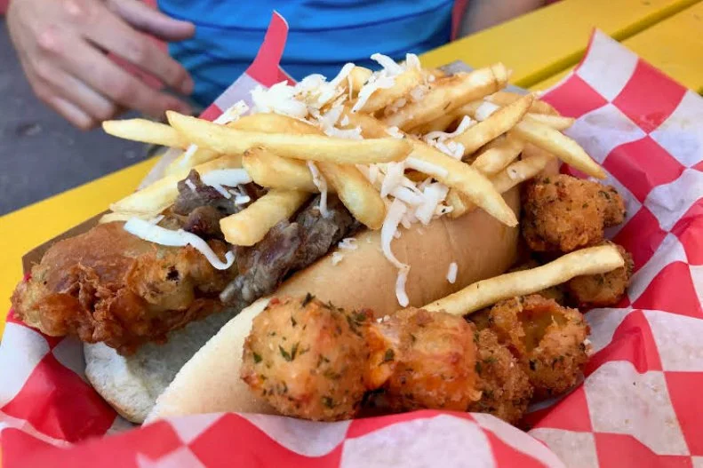 With a name like Hungry Dog, this place practically guarantees itâ  ll leave diners stuffed. A five-minute drive from the Worldâ  s Only Corn Palace, a top tourist destination in South Dakota, Hungry Dog serves a wide variety of franks and weenie-filled sandwiches, like the Philly cheesesteak-frankfurter hybrid, the Philly Dog, or a wiener-and-fried-shrimp Surf n Turf. The most-filling of all is the namesake dog, a fried, bacon-wrapped weenie, beer-battered and fried again and placed on a bun with shaved Ribeye, locally made Dimock Dairy pepperoni cheese and a pile of fries.