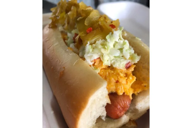 This East Nashville VW bus-turned-food truck aims to Southernize the hot dog. It features regional toppings, many of which are made from locally sourced ingredients, atop its weenies. The most-emblematic example of its style is the Hot Southern Mess (or HSM) featuring three Volunteer State staples: creamy coleslaw, house-made pimento cheese and locally made Tennessee hot chow chow, a sweet cabbage-based pickled relish that dates back to old-school country kitchens as a means to preserve the end of season bounty. Itâ  s all sandwiched together with its charcoal-grilled all-beef hot dog within a steamed, locally baked bun.