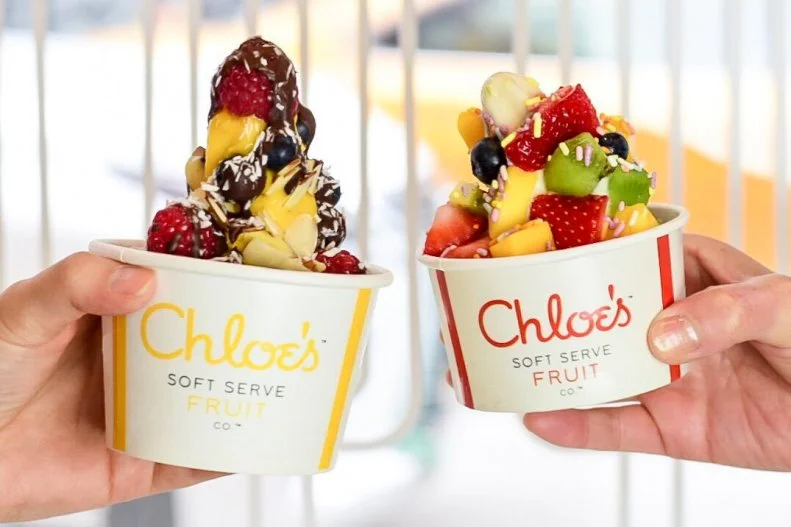 Fruit, water and just a touch of organic cane sugar are all that go into Chloeâ  s soft-serve machine. Founded by Chloe Epstein, a mother of three, former attorney and self-proclaimed fro-yo addict, the business was created to satisfy cravings for frozen yogurt without the artificial ingredients. Made from a sweet banana base, the flavors include dark chocolate made with actual cacao (a fruit in case you were wondering) along with 14 seasonal varieties including strawberry, mango, banana, pumpkin, cranberry and plum. Itâ  s creamy and sweet, with less than half the sugar of gelato or sorbet.