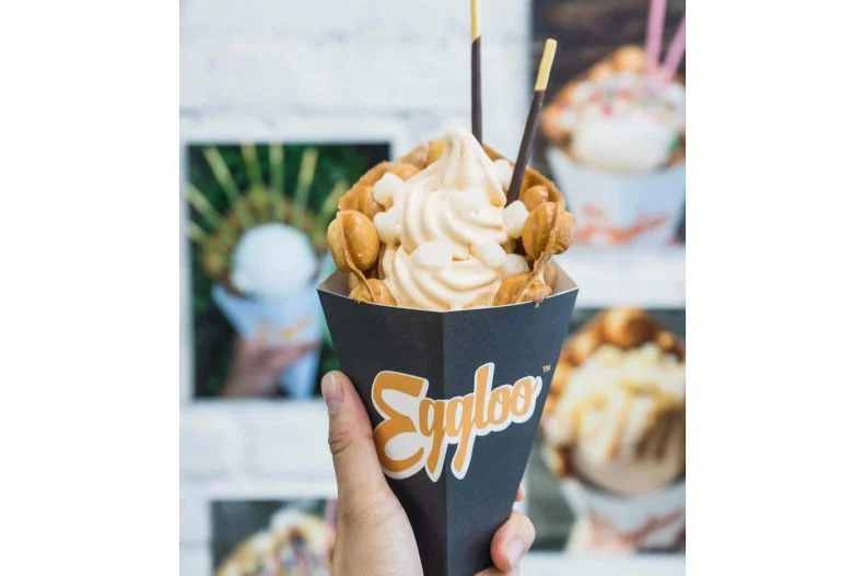 This Chinatown ice cream shop opened its doors in early 2016, with lines down the block despite 10-degree weather. The shop serves a selection of scoops and soft-serve in modern American and Asian-influenced flavors like strawberry cheesecake, pumpkin, cherry blossom and Earl Grey tea coated with unlimited toppings (think: crushed Oreos and Pocky) and drizzles (chocolate syrup and Vietnamese coffee). Whatâ  s really special is the vessel. Owners Mike Tan and David Lin worked through a long trial-and-error process to perfect their egg waffle cones. Those sweet pyramids are based off the partners' favorite childhood treat, the lofty spherical Hong Kong waffle they ate as kids from a famous street stand located just down the block from their Chinatown storefront.