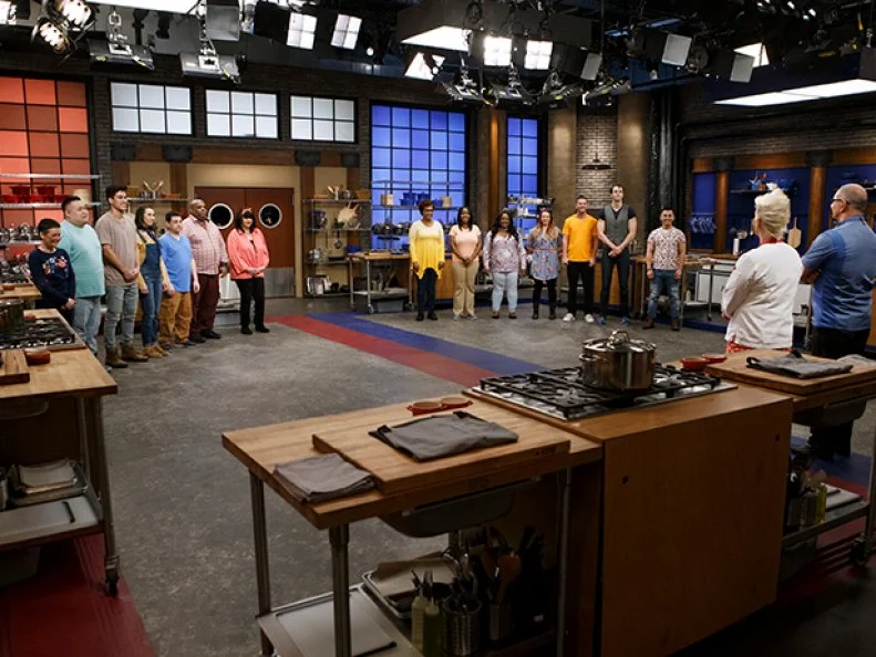 The recruits face mentors Robert Irvine and Anne Burrell before the baseline challenge, as seen on Worst Cooks in America, Season 14.