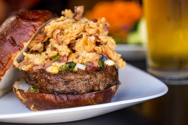 If you are a “Get Off My Lawn” type diner, then Kuma’s heavy metal, no-holds-barred style ain’t for you. A tap menu of local and regional beers greets diners along with a soundtrack of heavy metal music. The onslaught doesn’t stop with the food: Gargantuan burgers, topped with well-crafted condiments and add-on combinations, are named for metal bands. And as much as their hamburger menu is evilly delicious, their famous mac and cheese is the demon mistress, made daily and topped with any number of unique ingredients. It’s fun, loud and family friendly.