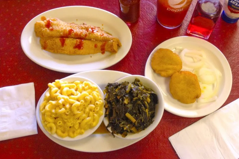 Often the best little places are tucked neatly into unsuspecting strip malls. Such is the case with Mississippi Belle, an ideal spot to get your down home cookin’ on in Indianapolis. Light, crispy fried catfish and chicken, vinegary greens, fried this and fried that with a side of biscuits, please, all in separate little bowls and plates, the tell-tale sign of a quality soul food place. Homey art hangs on the walls and friendly faces greet you and serve you what you’ve been missing — a real, goodness-gracious meal, Southern-style.