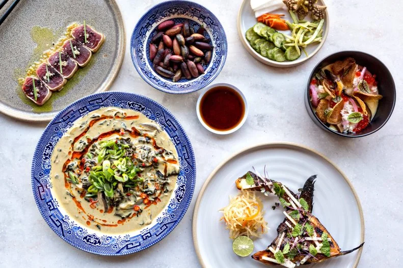 At Chef Carlos Salazar’s Rook, Asian street food is elevated into an unforgettable dining experience. His unique style and vision is directly drawn from his family, combining the characteristic flavors of Korean, China, Japan and Southeast Asia with his Filipino upbringing. Although the menu changes with the seasons, there are some items that never drop off, including the Rook Burger, with soft sesame pancakes, marinated Brussels sprouts and the playfulness of Big Mac–like ingredients like pickles and “special sauce.”