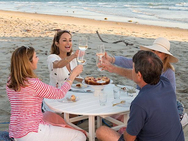 Giada De Laurentiis and friends enjoy a meal, as seen on Giada on the Beach, Season 1.