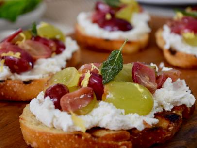 Close up shot of blistered grape bruschetta, as seen on Naughty & Delicious, Season 1.