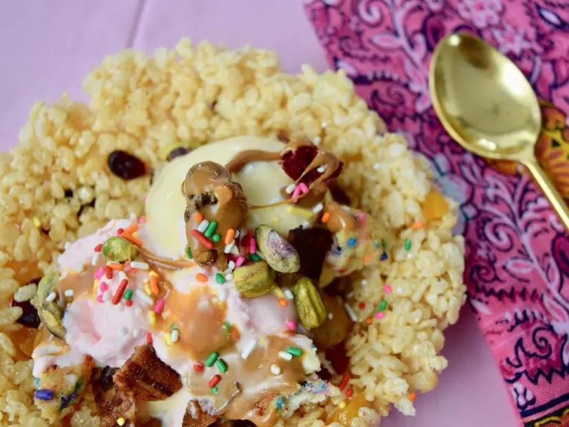 Overhead shot of cereal bowl with ice cream and maraschino cherry whipped cream, as seen on Naughty & Delicious, Season 1.